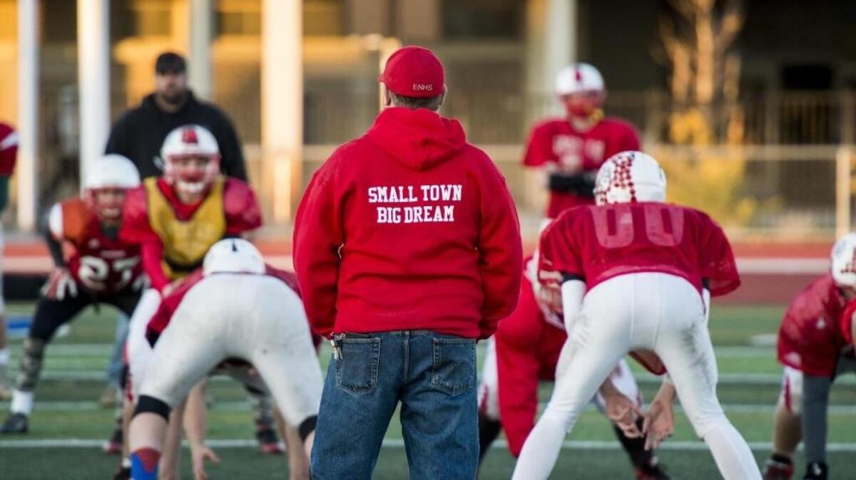 Coach Travis Barker (center) oversees a East Nicolaus football practice last December before his team went on to win a state championship. The Spartans will play a Northern California Regional game Saturday against McClymonds of Oakland.