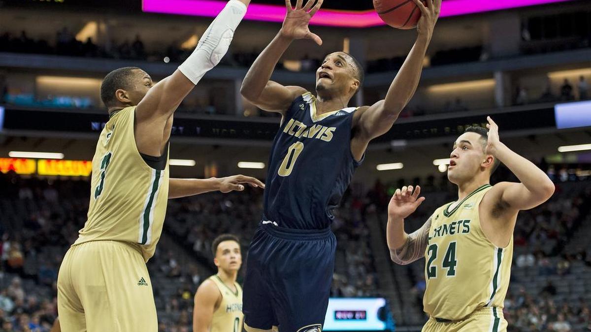 UC Davis Aggies guard Brynton Lemar (0) drives to basket past Sacramento State Hornets forward Justin Strings (3) and Sacramento State Hornets guard Izayah Mauriohoohoo-Le'Afa (24) during the second half of the NCAA Double Header game at Golden 1 Center on Monday November 21, 2016 in Sacramento.