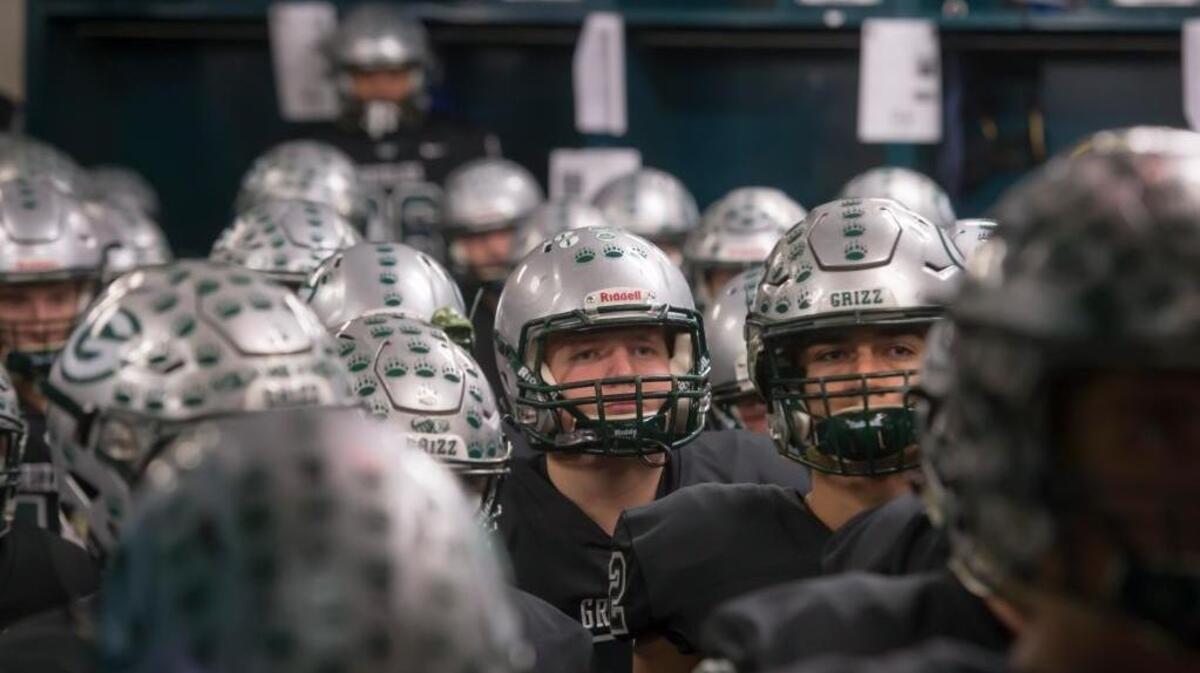 The Granite Bay Grizzlies get ready inside the locker room before hosting the Del Oro in the Sac-Joaquin Section Division II championship game Saturday at Hornet Stadium at Sacramento State.