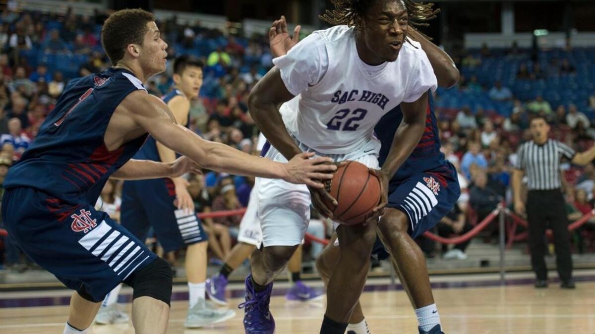 Sacramento High School’s Solomon Young (22) and his teammates put their unbeaten record on the line Monday against Moreau Catholic of Hayward on Monday, Jan. 18, 2016 at the Martin Luther King Classic at Haas Pavillion in Berkeley. ... Young drives toward the basket while being defended by Modesto Christian’s Christian Ellis (1) during a Sac-Joaquin Section Division II boys final on Saturday, March, 7, 2015 at Sleep Train Arena in Sacramento.