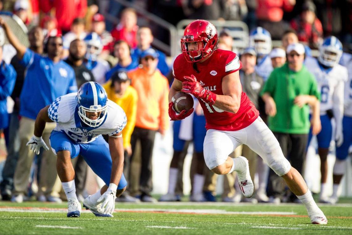 Louisville tight end Cole Hikutini grabs a short reception and charges to the end zone. The University of Louisville hosted Kentucky, Saturday, Nov. 26, 2016 at Papa John's Cardinal Stadium in Louisville.