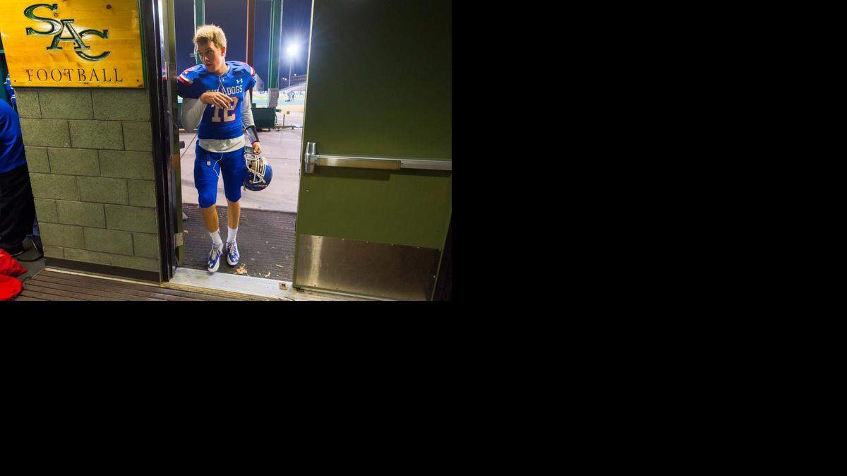 
Bulldogs quarterback Jake Browning enters the locker room before Folsom High School’s game against Tracy High in the SAC-Joaquin Section Division I Championship game at Sacramento State earlier this month. Browning has accounted for more touchdowns than any teenage quarterback in the United States, ever.
