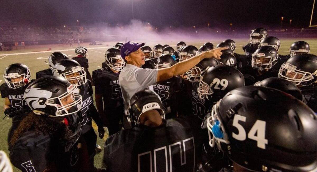 Franklin coach Mike Johnson talks to his team before playing Elk Grove at Cosumnes Oaks High School on Oct. 27.