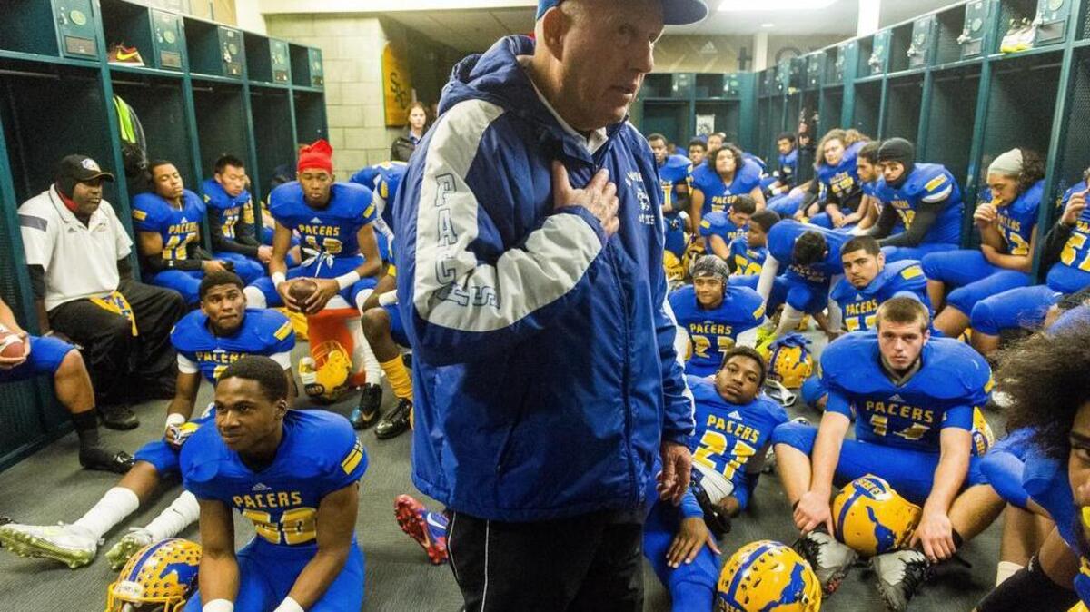 
Grant High School football players listen to head coach, Mike Alberghini, talk before the game as Grant High School plays St. Mary’s High School in the Sac-Joaquin Section Division II Championship game at Sacramento State, Friday December 5, 2014. 
