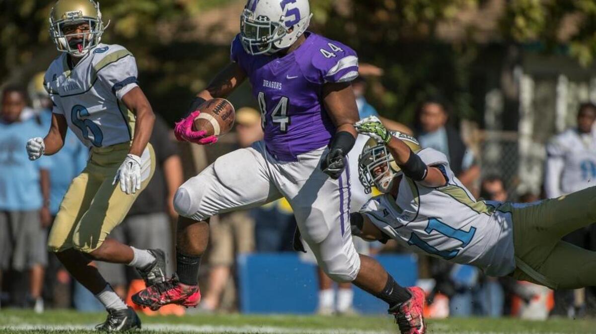 Sacramento High School running back Troy Sampson (44) races down field during the second half of a game against visiting Burbank High on Saturday, Oct. 31, 2015, at Sac High in Sacramento.