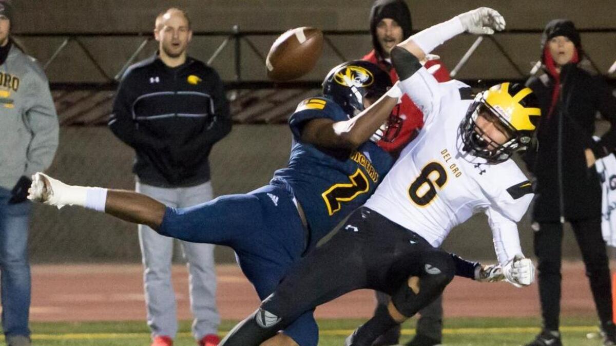 Del Oro’s Johnny Guzman (6) is defended by Inderkum’s Tim Gay during a Sac-Joaquin Section Division II game on Nov. 17. Guzman had two big scoring plays against Central Catholic on Nov. 24 in a 23-12 victory.