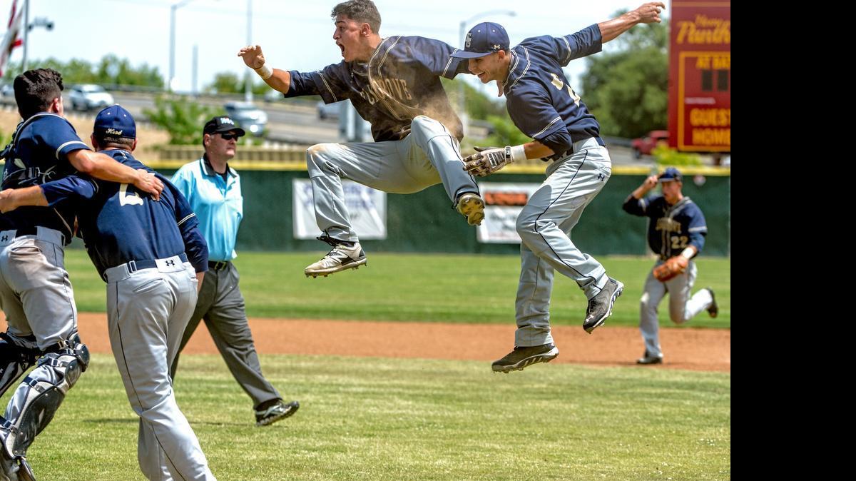 
Elk Grove Thundering Herd's Carlos Moseley (5), celebrates with his teammate Nick Madrigal (2), after their 5-2 victory in the Sac-Joaquin Section Division I championship baseball game at Sacramento City College, Saturday May 30, 2015. Elk Grove swept the best of three games series in two games.
