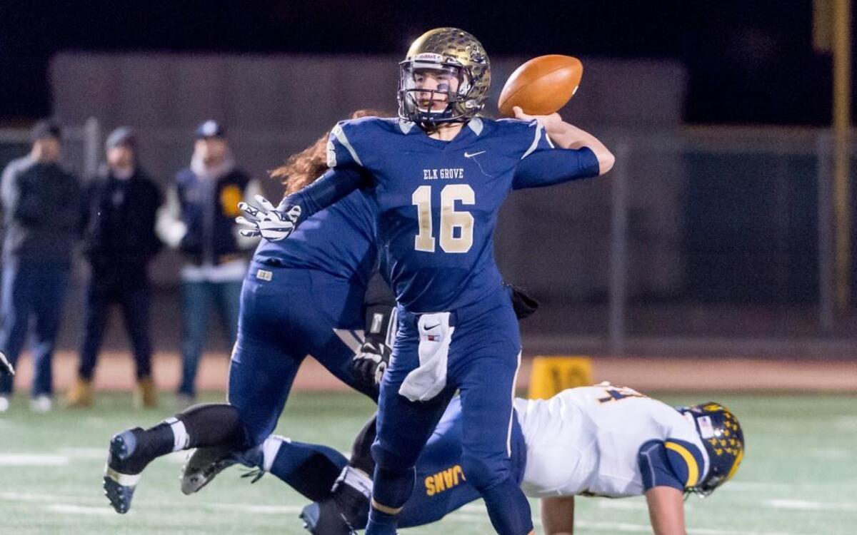 Elk Grove quarterback Jayden Machado looks for a receiver during the Sac-Joaquin Section Division I semifinal football game at Elk Grove High School on Friday, Nov. 27, 2015. Machado was named The Sacramento Bee’s Player of the Week on Thursday, Oct. 6, 2016.