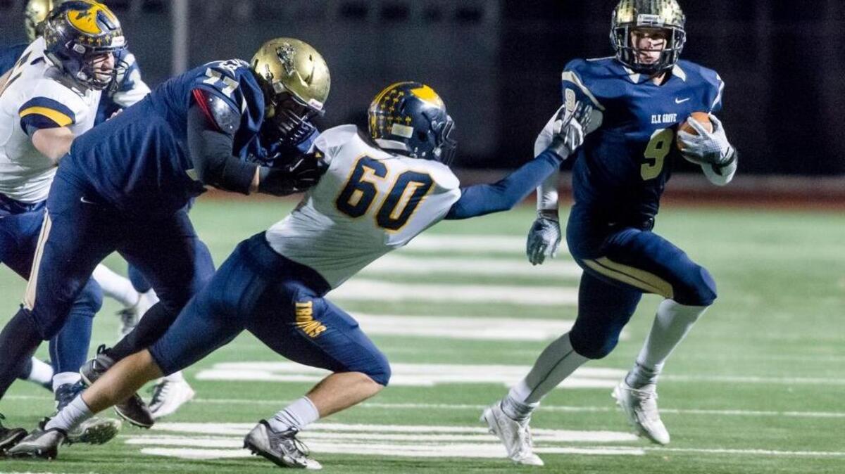 Elk Grove High’s Ryan Robards, right, will play baseball at Pacific next season. ... Robards tries to turn the corner during a Sac-Joaquin Section Division I semifinal football game against Oak Ridge, Friday, Nov. 27, 2015 at Elk Grove High School.