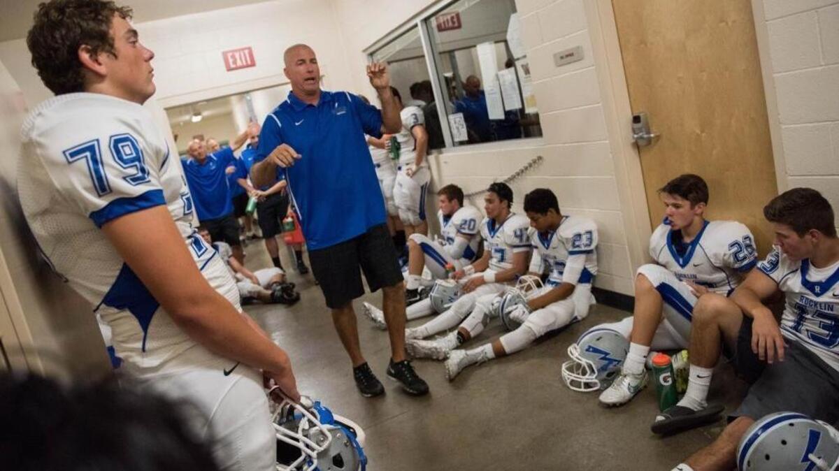 
Rocklin defensive coordinator Jason Adams, talking to players at halftime of their game against Whitney High School on Sept. 12, 2015, says the re-addition of Chase Hatada “makes us a much better team.”
