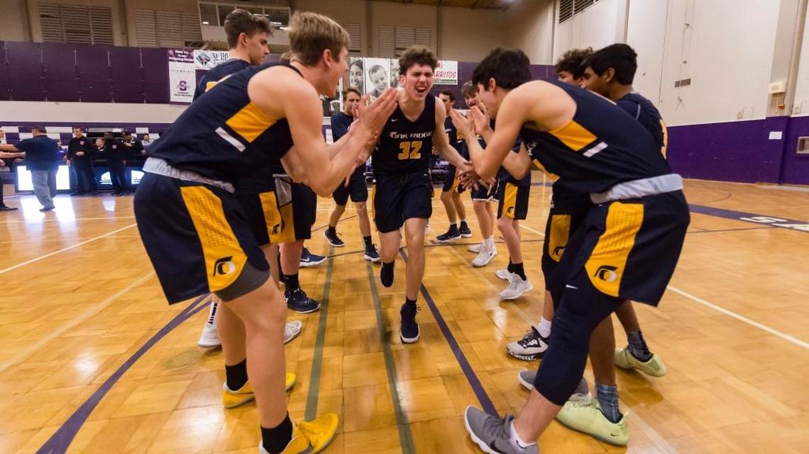 Cade Hoppe, center, led Oak Ridge to an upset victory over host Sacramento on Wednesday in the Sac-Joaquin Section Division I boys basketball playoffs.
