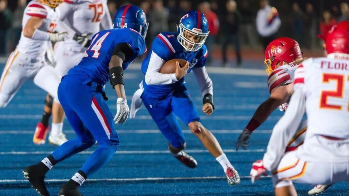 Folsom quarterback Kaiden Bennett runs against Jesuit in a Sac-Joaquin Section Division I semifinal on Nov. 24.