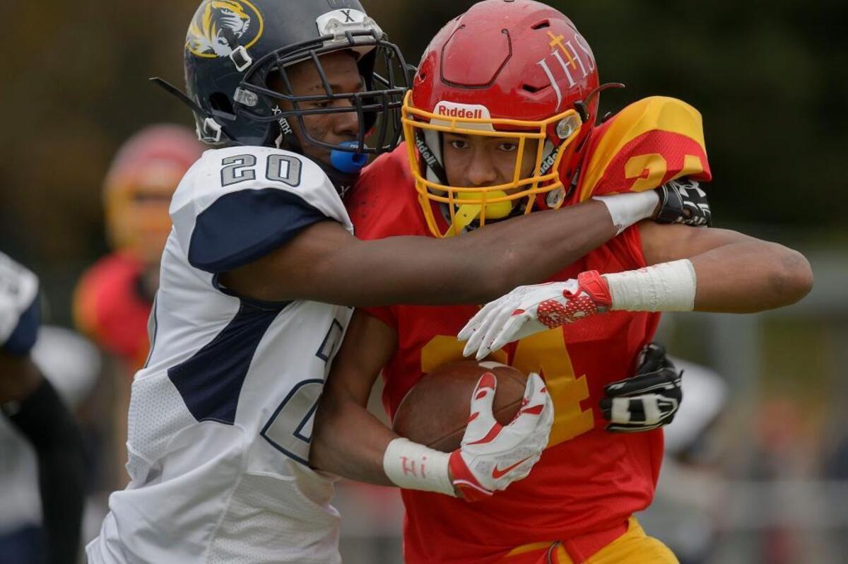 Jesuit’s Isaiah Rutherford, right, received his first scholarship offer from Alabama, of all places. He is a running back/defensive back.