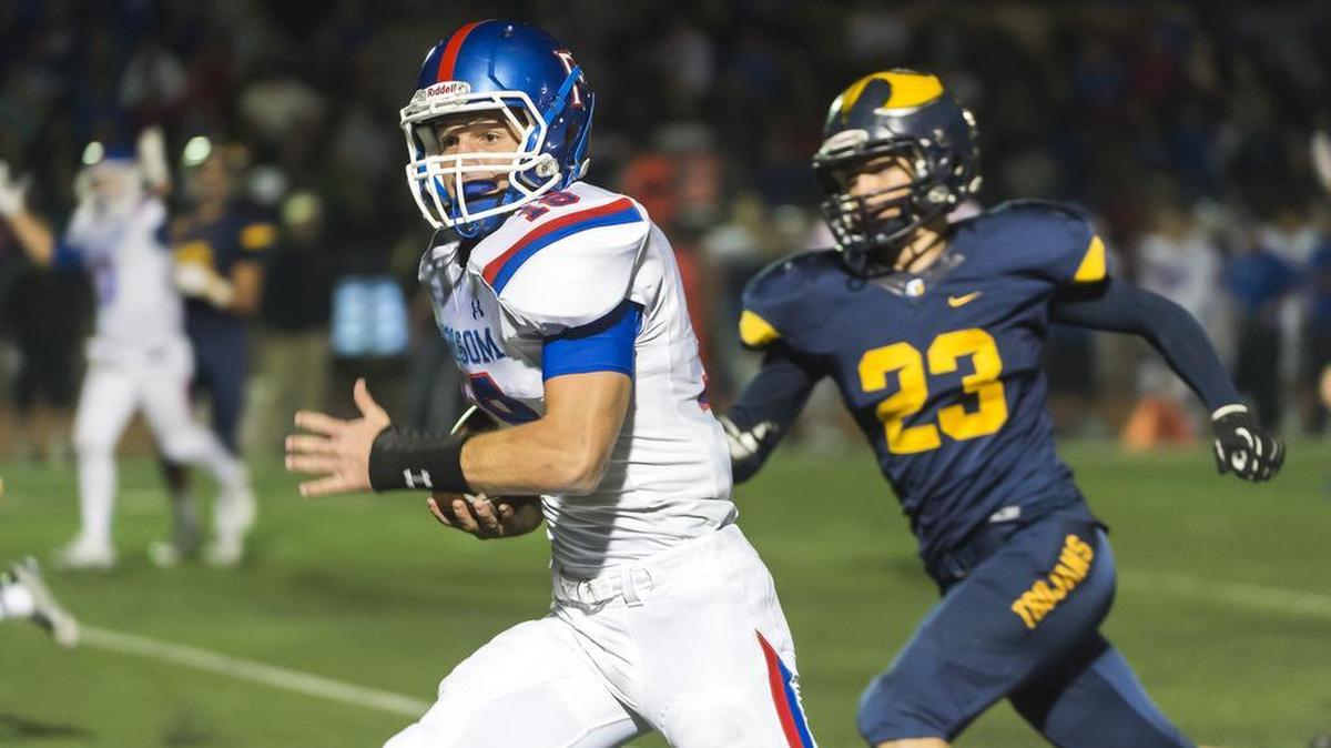 Oak Ridge Trojan Truman Andrus (23), chases Folsom Bulldogs Jake Jeffrey (18), as he runs for a touchdown to lead 28-13 after the point after attempt was good as the Oak Ridge Trojans host the Folsom Bulldogs, Friday October 30, 2015.