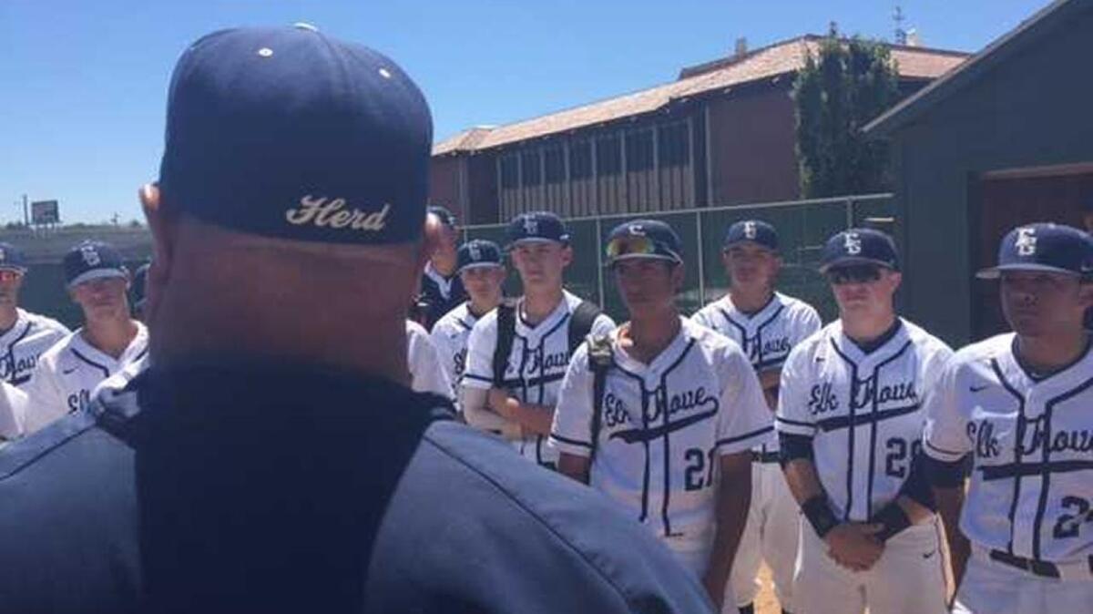 Elk Grove baseball coach Jeff Carlson addresses his team after a 4-1 Sac-Joaquin Section Division I North playoff win at Sacramento City College on Saturday, May 20, 2017.
