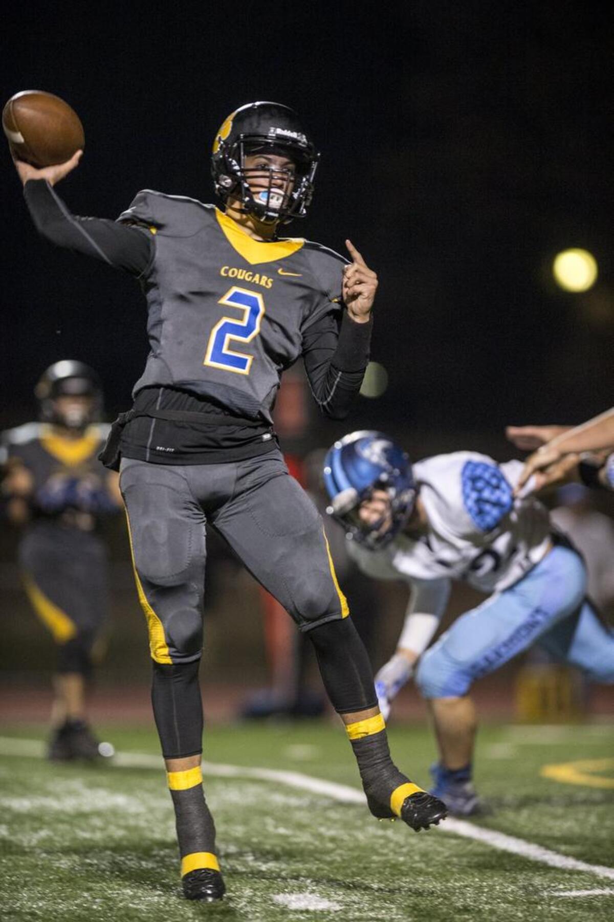 Del Campo QB Tyler Dimino throws a eight yard touchdown pass in the second quarter as Del Campo hosts Oakmont on Thursday night, October 26, 2017.