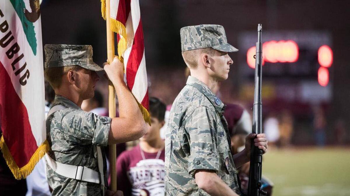 
The Whitney color guard marches out to the field before the national anthem at the Quarry Bowl between the Rocklin High School Thunder and Whitney High School Wildcats on Friday, September 11, 2015.
