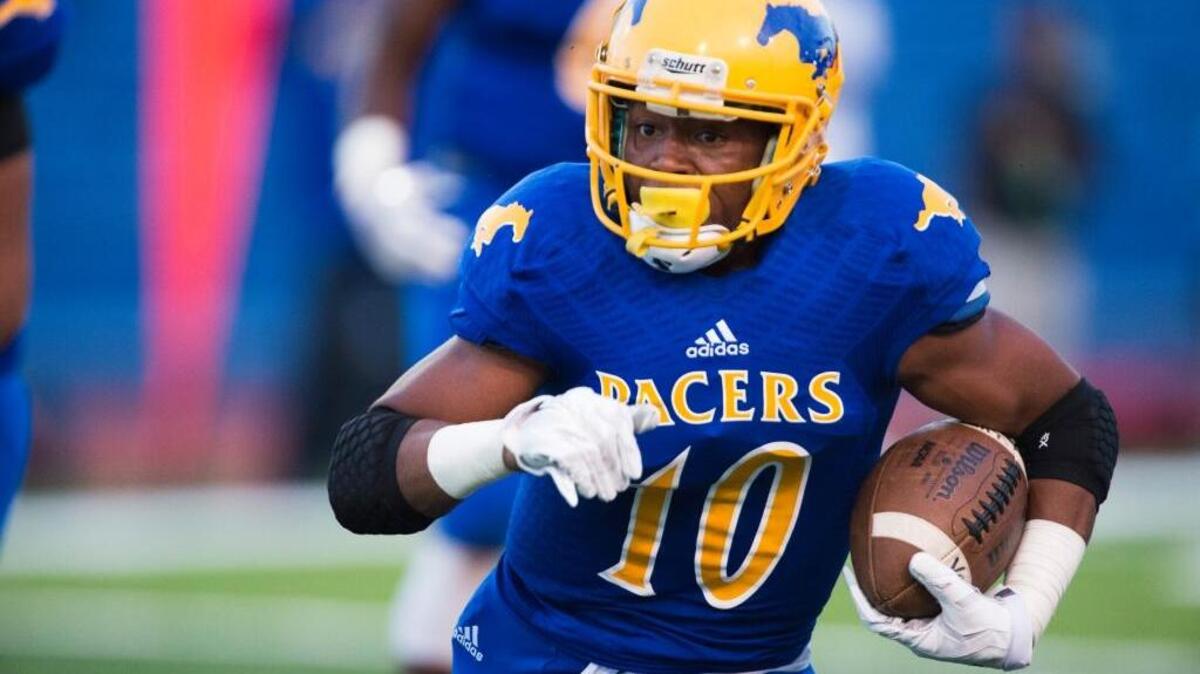 Grant High School’s Deshawn Collins runs with the ball during a high school football game against visiting Burbank on Friday August 28, 2015. On Nov. 6, Collins became the first area back to rush for 2,000 yards in back-to-back seasons.