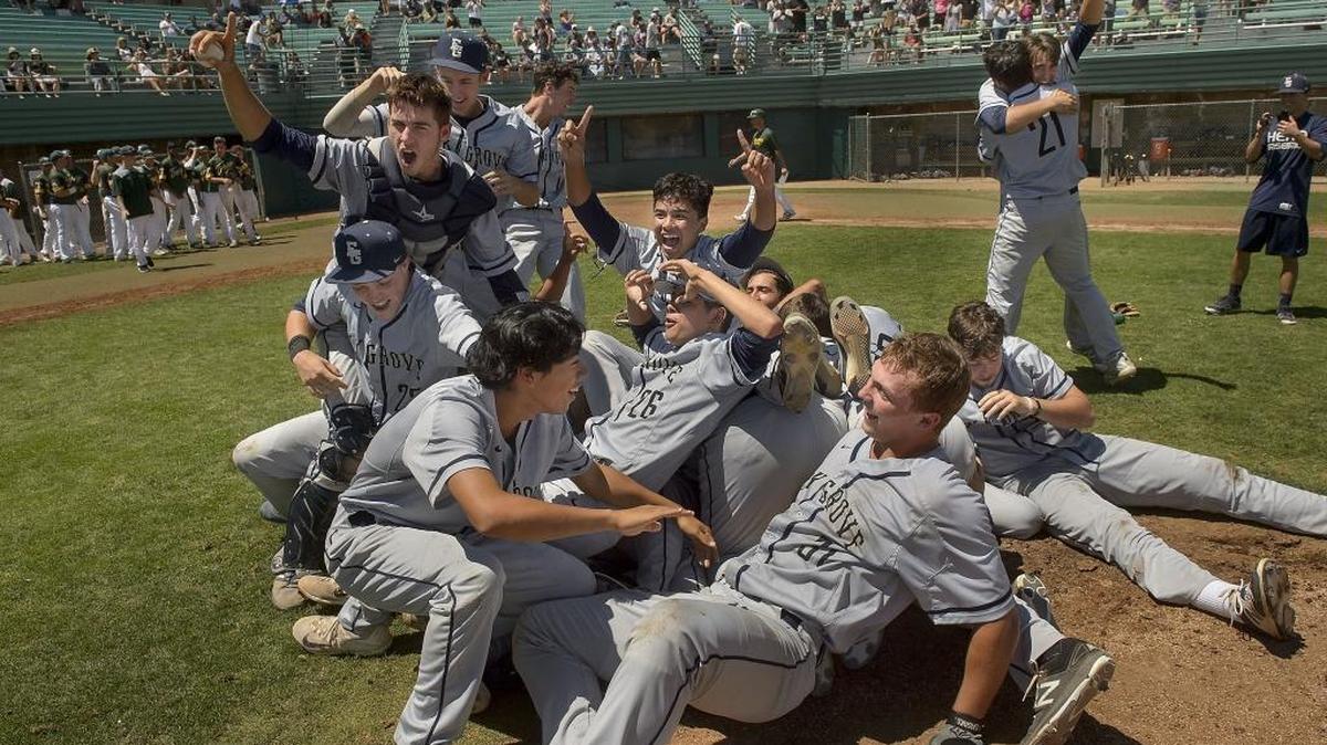 The Elk Grove Thundering Herd celebrates after winning the Sac-Joaquin Section Division I baseball title against the Tracy Bulldogs at Sacramento City College in Sacramento on Saturday, June 3, 2017. The Thundering Herd won the game 22-6.