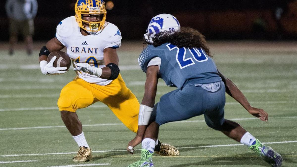 
Grant’s Deshaw Collins (10) tries to evade Wildcats’ Kaderro Tamondong (20) in the first quarter, as the Franklin Wildcats host the Grant Pacers at Cosumnes Oaks High School on Friday.
