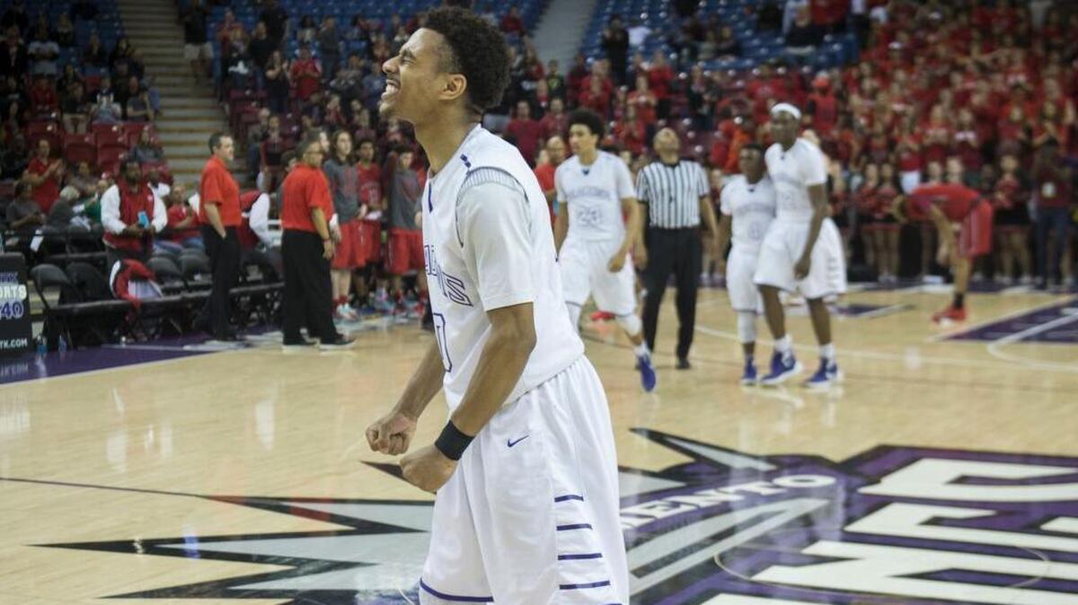 Sacramento High School guard Andrew Williams (C) (10) celebrates his team's victory against Antelope High School in their Sac-Joaquin Division I championship at Sleep Train Arena on Saturday, Mar. 5, 2016 in Sacramento.