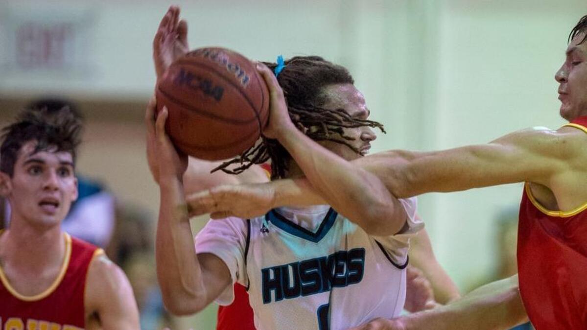 Sheldon guard Dale Currie, center, looks to pass before he is fouled with a few seconds remaining in the fourth quarter against Jesuit on Friday at Sheldon High School.