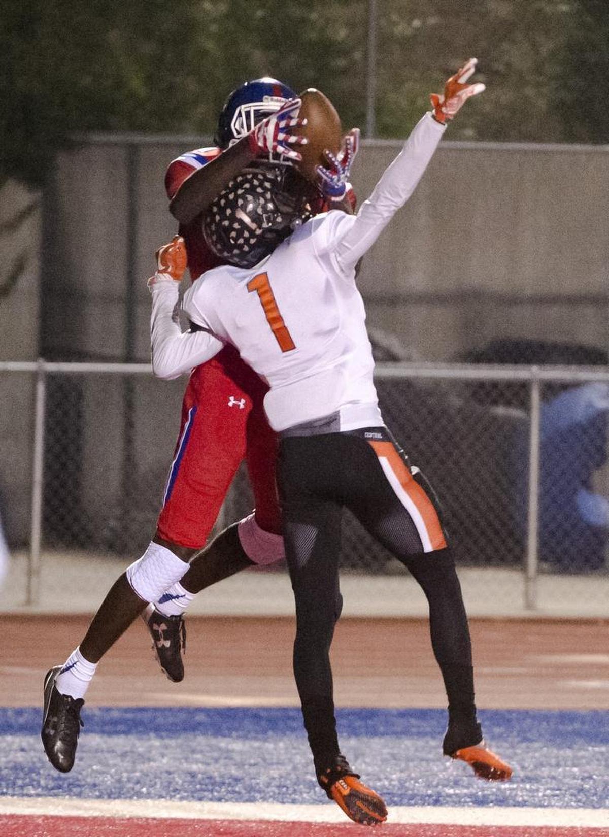 Folsom Bulldogs Joe Ngata (10), catches the ball for a touchdown to tie the game at 7-7 after the point after attempt was good during the first quarter as the Folsom High School Bulldogs varsity football team hosts the Central High School Grizzlies in the CIF NorCal Division I-AA title game, Friday Dec 8, 2017.