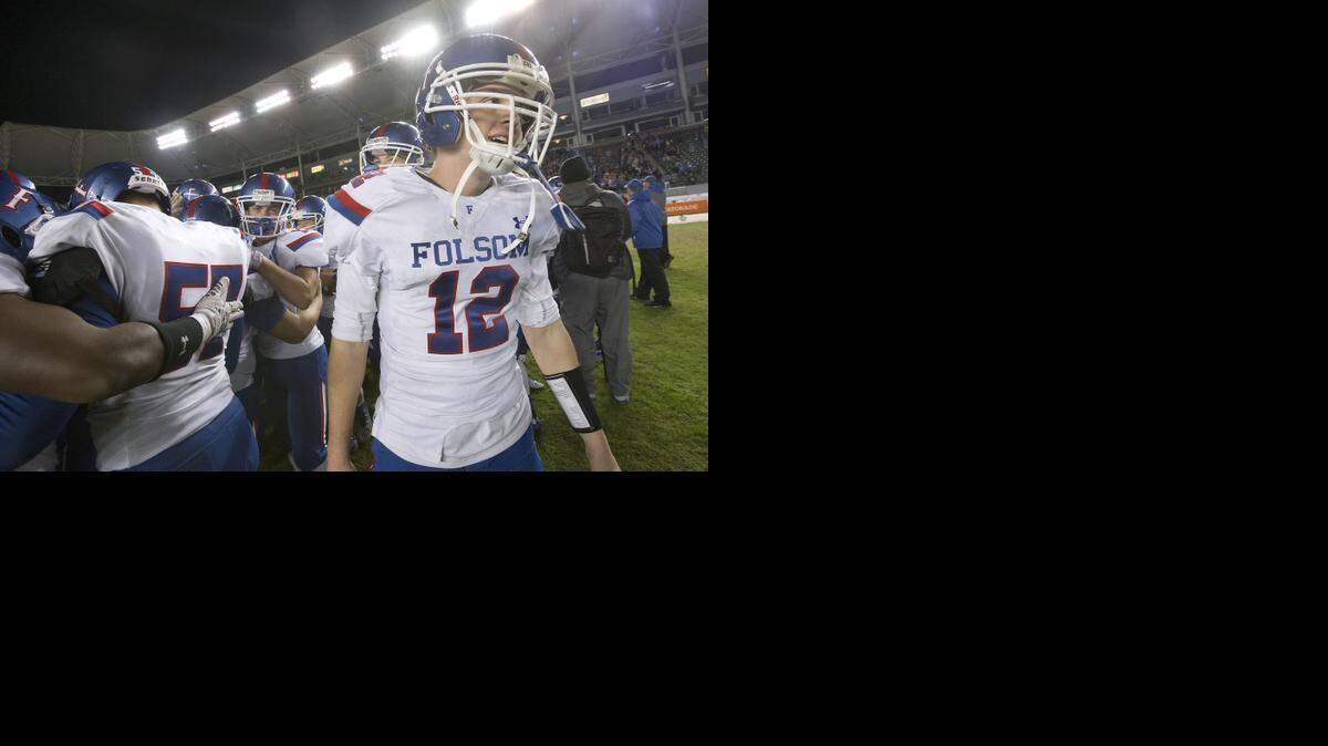 
Folsom Bulldogs star Jake Browning (12) celebrates with teammates following the CIF Division I State Championship game between the Folsom High School Bulldogs and the Oceanside High School Pirates at the StubHub Center in Carson, CA on Friday, December 19, 2014.
