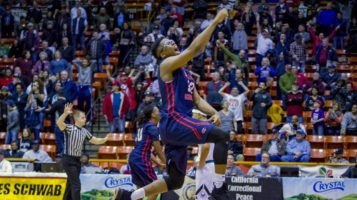 Modesto Christian’s Gabe Murphy celebrates his team’s 60-56 victory over Sheldon in the CIF Sac-Joaquin Section Division I boys basketball championship game Saturday at Spanos Center in Stockton.
