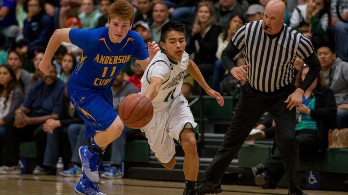 Liberty Ranch’s Marcus Guerrero is among a group of players in the Hawks’ current rotation. ... Guerrero, right, steals a ball from Anderson’s Max Klaiber during a CIF state basketball playoff game, Wednesday, March 11, 2015 at Liberty Ranch High School in Galt.