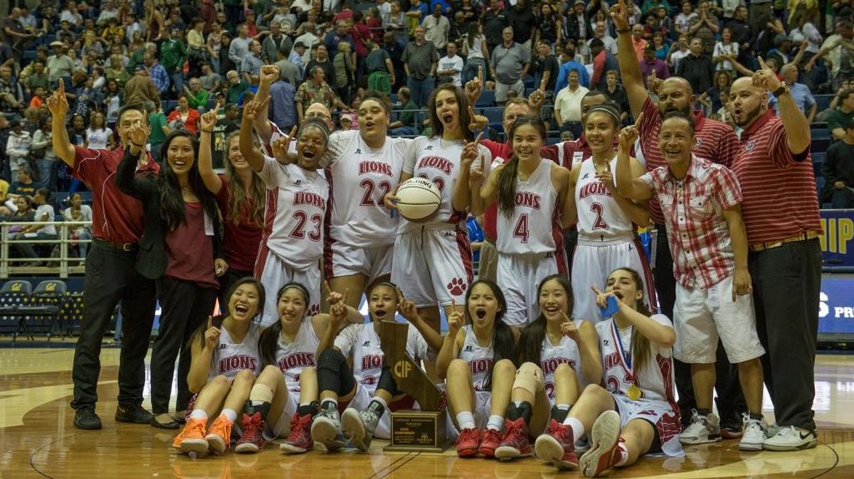 The McClatchy High girls basketball team celebrates following its 65-61 double-overtime victory over Serra in the CIF Division 1 state championship game on March 27, 2015, at Haas Pavilion in Berkeley.