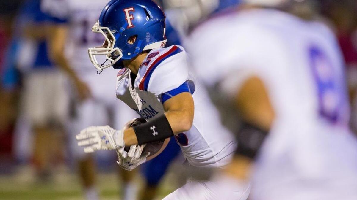 
Folsom’s Jake Jeffrey shifts from wide receiver to quarterback. He had 65 receptions for 859 yards and 14 touchdowns as a junior last season. He’s shown here picking up yards against Rocklin during the 2014 season.
