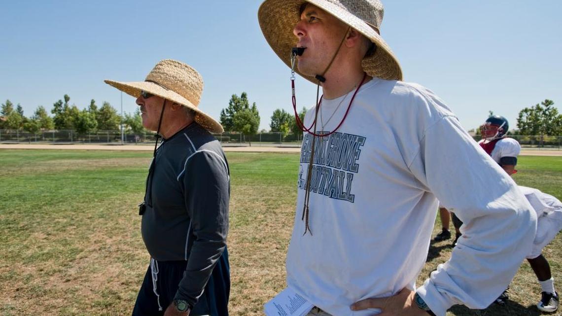 Sheldon Huskies coach Joe Cattolico has made football a family affair. His father Butch, left, is an assistant coach.