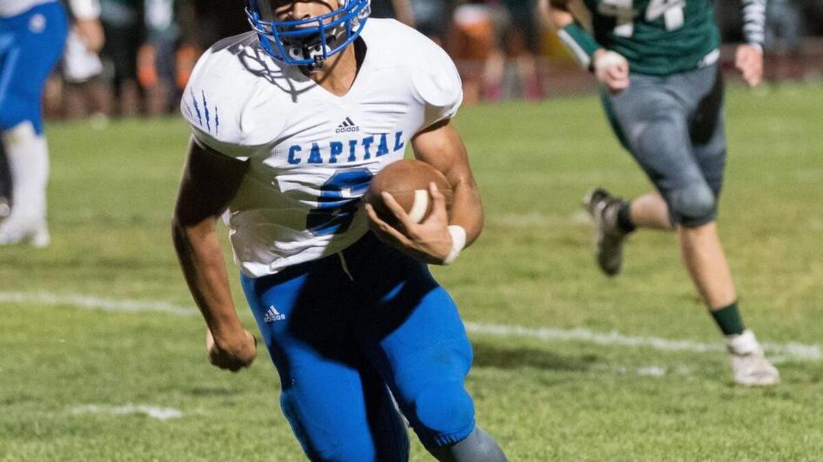 
Capital Christian’s Julian Leslie runs for a TD in the Cougers’ 47-0 rout of Dixon on Friday night. 
