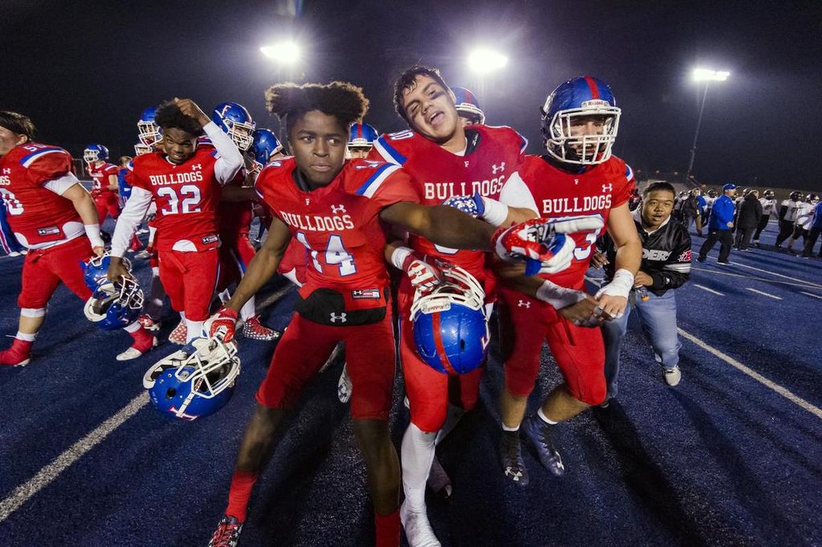 The Folsom Bulldogs celebrate their 54-35 win over the Central High School Grizzlies in the CIF NorCal Division I-AA title game, Friday Dec 8, 2017. The winner of this game will face the CIF SoCal winner in the State Championship game at Sacramento State, Friday Dec 15th.