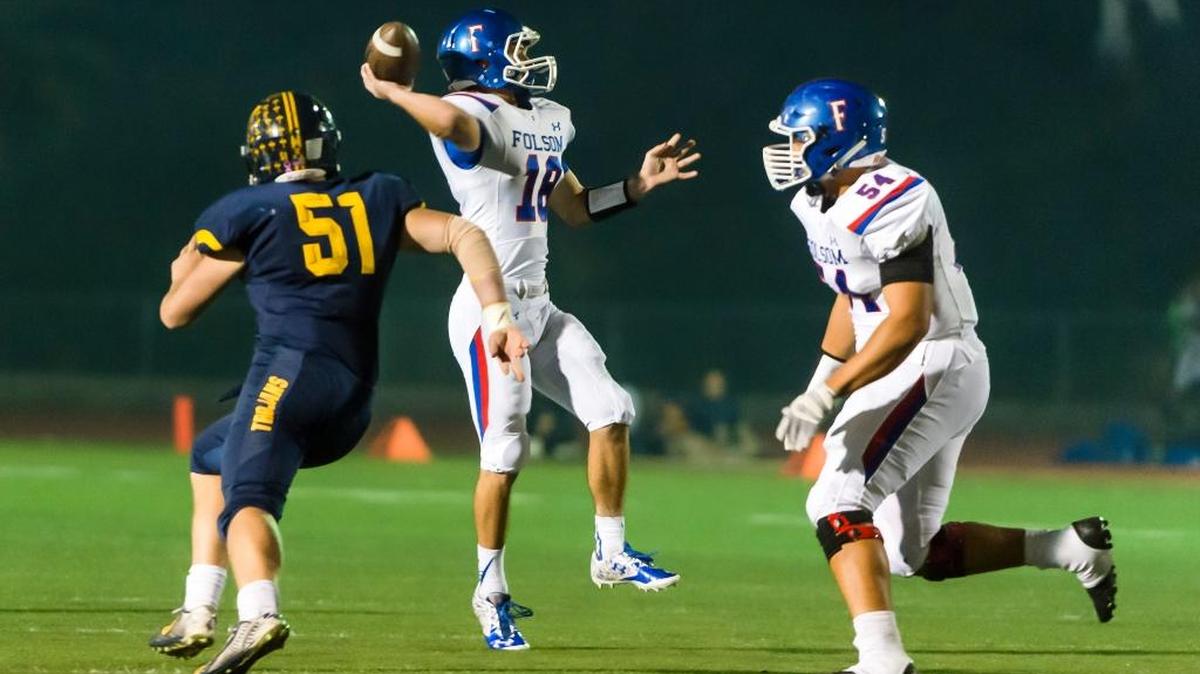 Quarterback Jake Jeffrey (18) and the Folsom High School football team seek their fourth consecutive Sac-Joaquin Section championship. Jeffrey gets off a pass against visiting Oak Ridge in a game on Friday, Oct. 30, 2015.