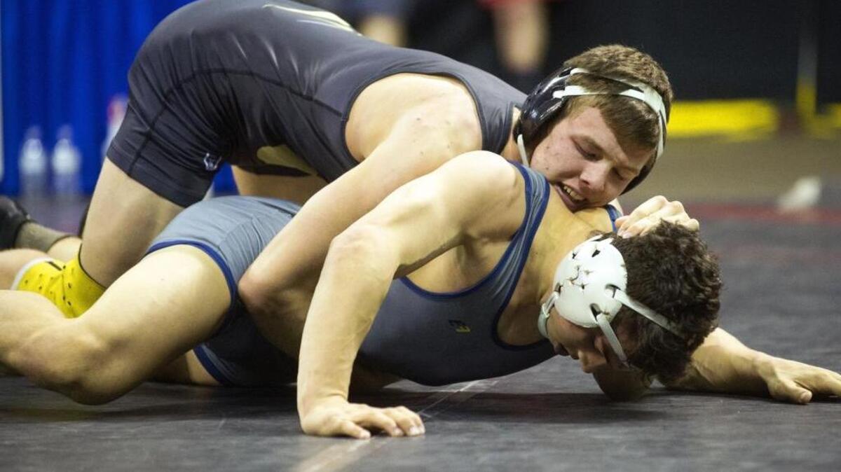 Del Oro wrestler Justin Burrage holds his opponent down during the Sac-Joaquin Section Masters Wrestling Finals at the Stockton Area on Saturday.