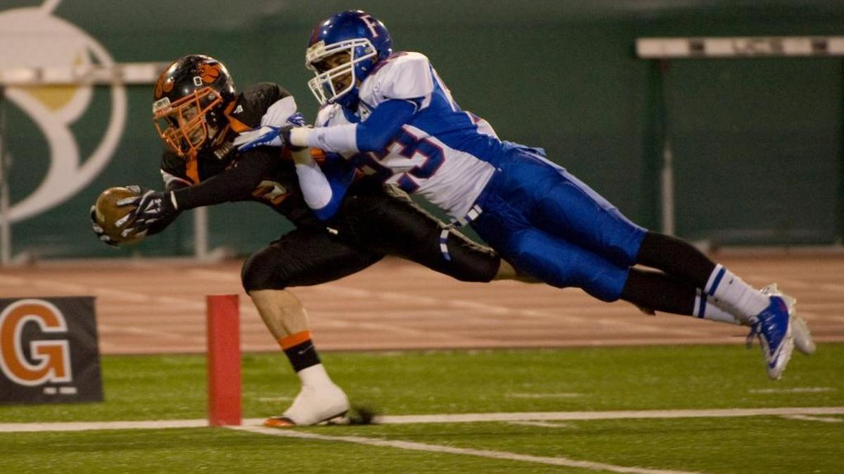 Folsom High School and Vacaville met for the 2011 Sac-Joaquin Section Division II football championship at Sacramento State. ... Vacaville’s Terrance Trueblood, left, dives in the Dec. 3, 2011 game.