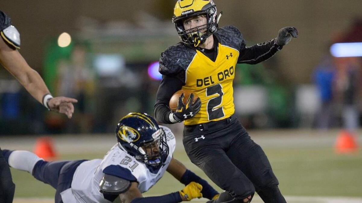 Mason Hurst (2), evading a would-be tackler against Inderkum on Friday, is Del Oro’s do-everything star.