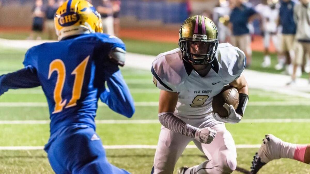 Elk Grove High senior Ryan Robards, right, rushes for a touchdown against Grant on Friday, Oct. 2, 2015, at Grant High School in Sacramento, Calif. The Thundering Herd is 12-0 behind Robards, who is tops in Northern California with 2,501 yards. He’s scored 38 touchdowns.