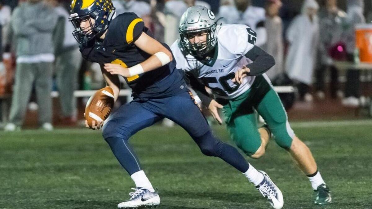 Oak Ridge quarterback Marco Baldacchino (2), runs with the ball during a high school football game against Granite Bay on Friday, Oct. 14, 2016 in El Dorado Hills. Baldacchino is a cousin of former Folsom High standout Dano Graves, The Bee’s Player of the Year in 2010.