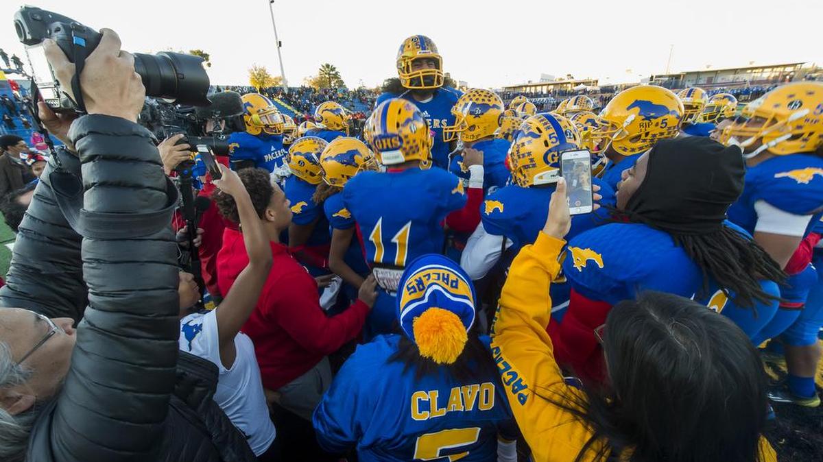 The Grant High School Pacer's get fired up before the game as the Grant Pacers host the Beyer High School Patriots in the Sac-Joaquin Section/Les Schwab Tires Division II first round playoff game, Monday Nov 16, 2015. Last Fridays game was rescheduled for this evening after senior football player Jaulon Clavo was killed and another shot just hours before the game.
