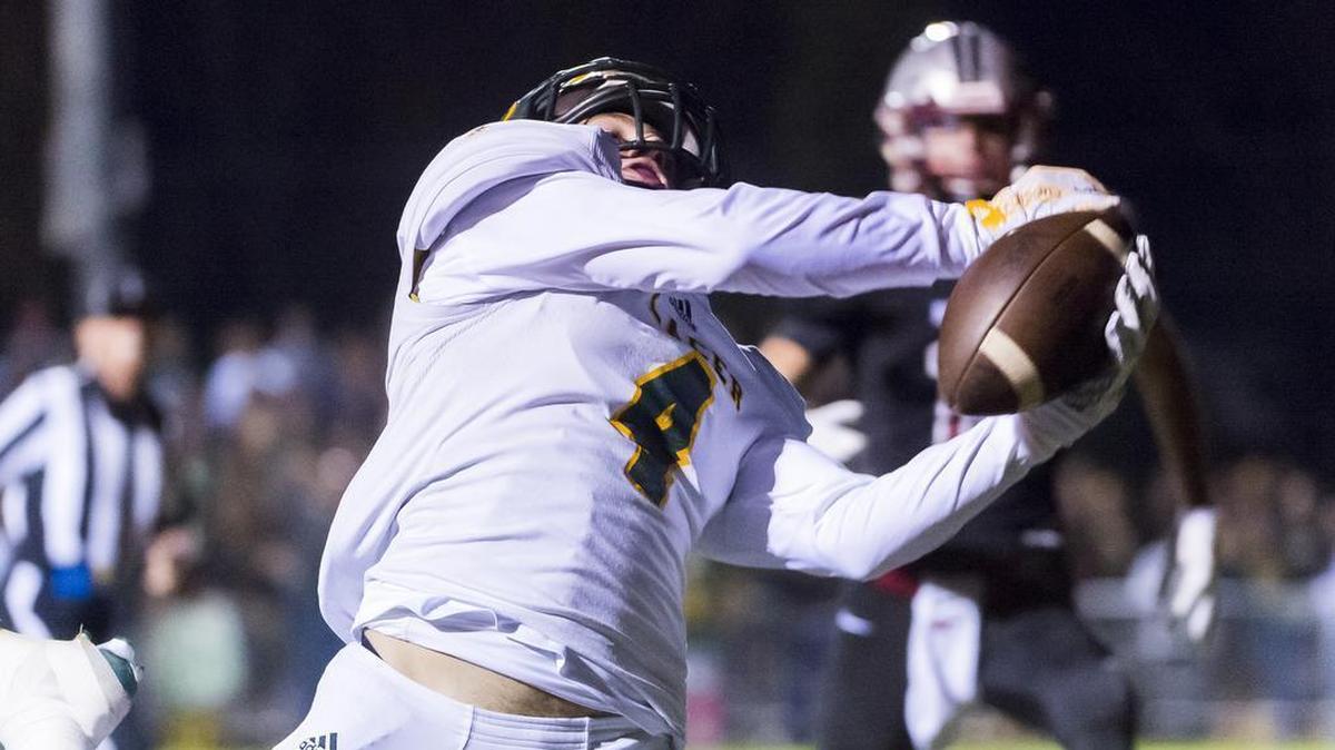 Placer High School Hillmen's Derek Haney (4), catches the ball during the first quarter as the Bear River Bruins host the Placer Hillmen, Friday October 23, 2015.