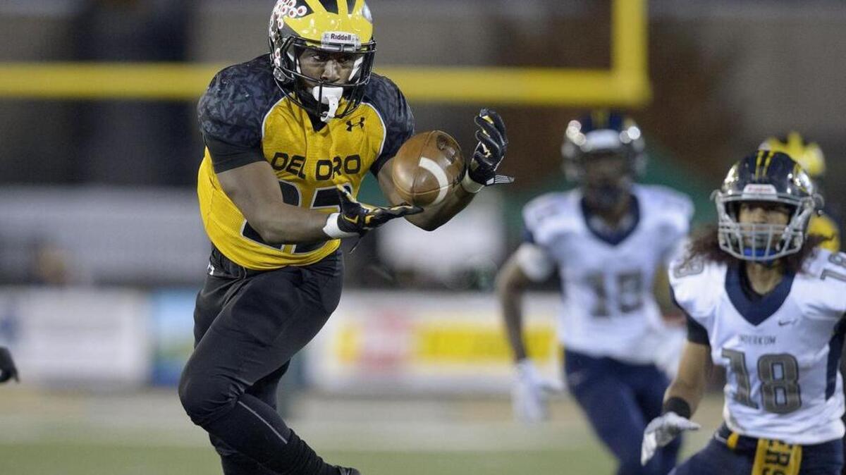 Del Oro’s Camrion Davis (23) intercepts a pass on the third play of the game to set up the Golden Eagles first score to put them ahead 6-0 during the Sac-Joaquin Section Division II championship game between Del Oro and the Inderkum Tigers at Sac State in Sacramento on Friday, December 2, 2016.
