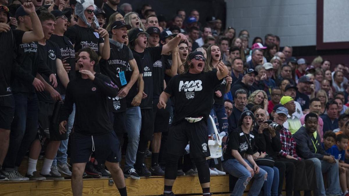 The Woodcreek High School student section reacts late in the fourth quarter before the Timberwolves beat the Capital Christian Cougars at the CIF NorCal Open Division playoff at Woodcreek High School on Friday, March 10, 2017, in Roseville.