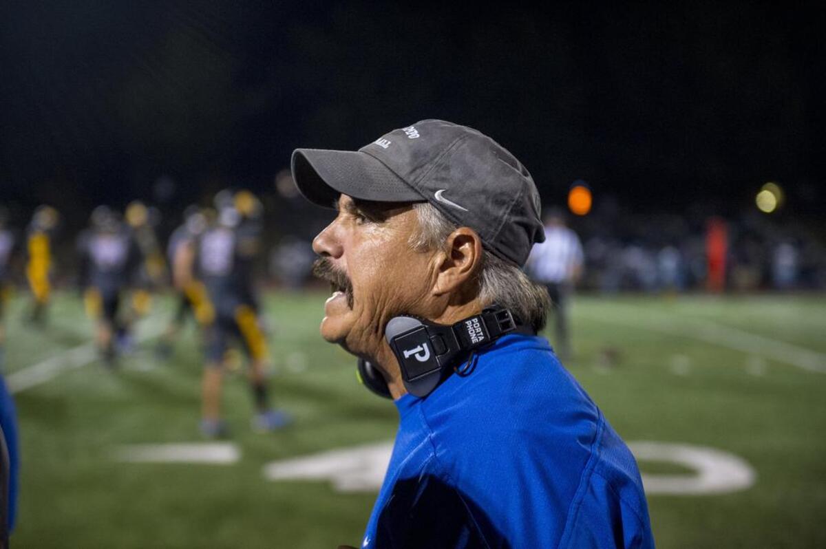 Coach Mike Dimino, a retired CHP officer reacts as the defense prepares to takes the field in the second quarter as Del Campo hosts Oakmont on Thursday night, October 26, 2017.