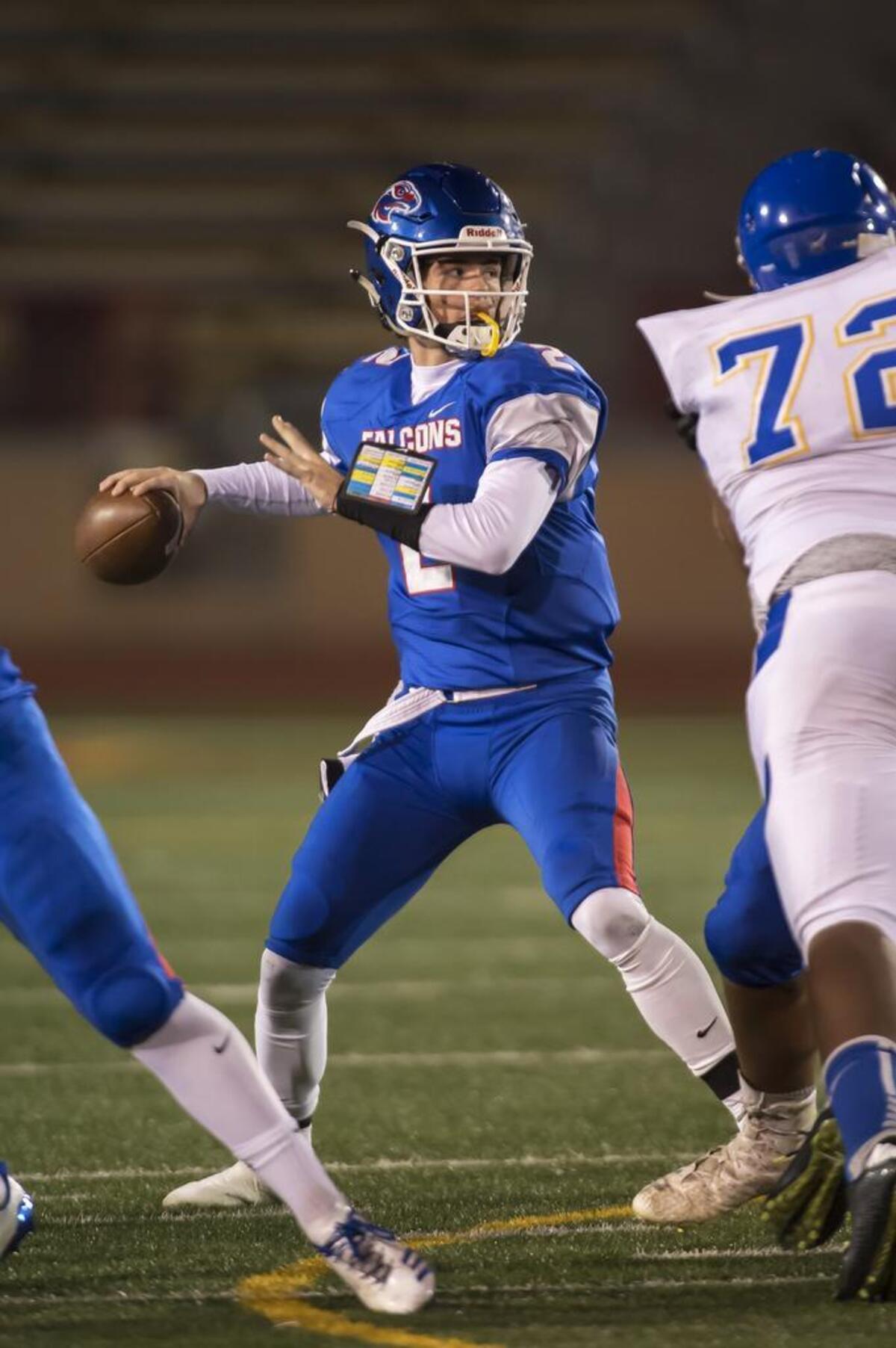 Christian Brothers Falcons Gunnor Faulk, (2), passes the ball as they host the Bencia Panthers in the Sac-Joaquin Section Division III playoff opener at Hughes Stadium, Friday Nov 10, 2017.