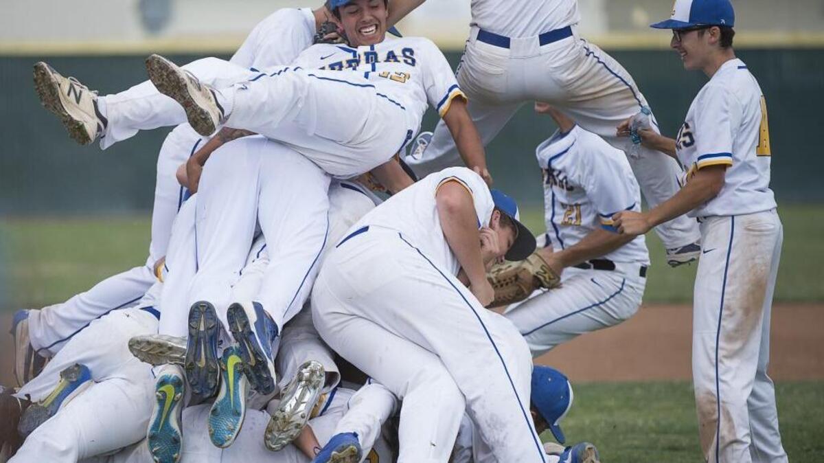 Lincoln High School baseball players celebrate after beating Placer on Monday in the Sac-Joaquin Section Division IV championship at Sacramento City College.