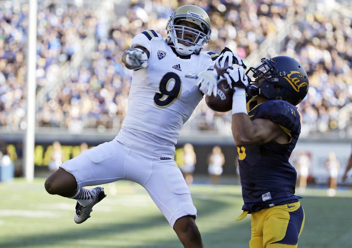 UCLA defensive back Marcus Rios (9) breaks up a pass intended for California wide receiver Chris Harper, right, during the fourth quarter of a NCAA college football game Saturday, Oct. 18, 2014, in Berkeley.