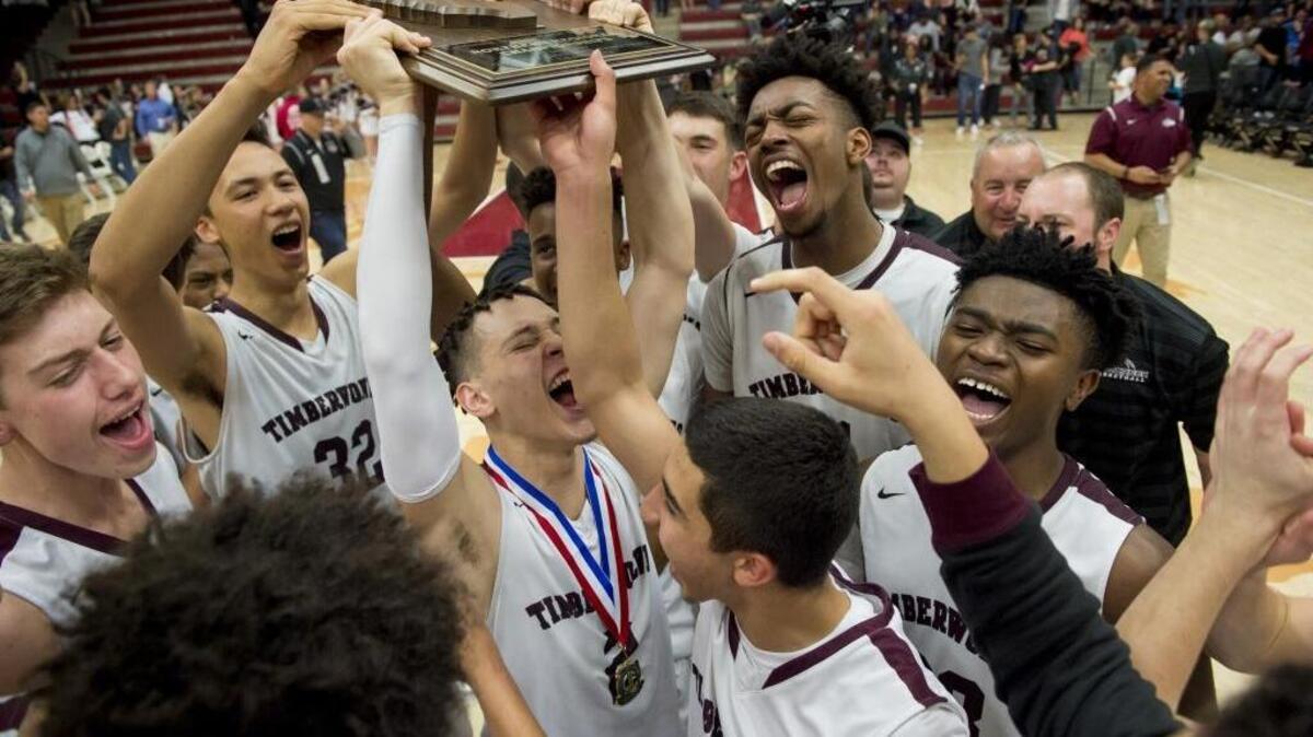 The Woodcreek Timberwolves celebrate their CIF Northern California Open Division championship after beating Sheldon 66-59 at Leavey Center in Santa Clara on Saturday.